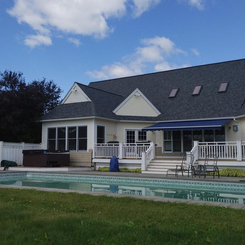 Architectural asphalt shingle roof with skylights and deck