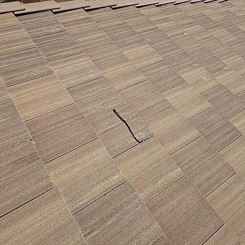 Tile roofing with visible cracked tile in Arvada Tile roofing with visible cracked tile in Arvada