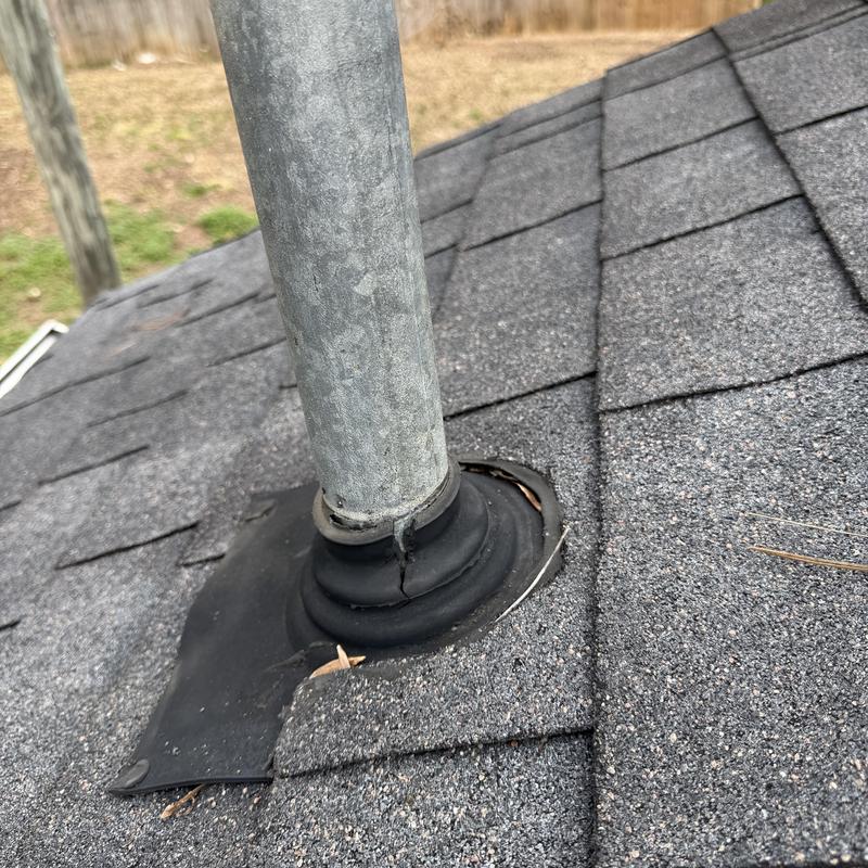 Electrical mast boot with tear on shingle roof