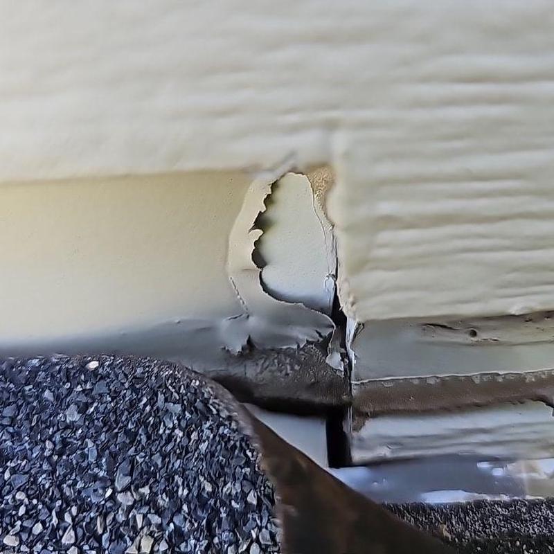 Shingle roof step flashing damage and wall siding gap Shingle roof step flashing damage and wall siding gap