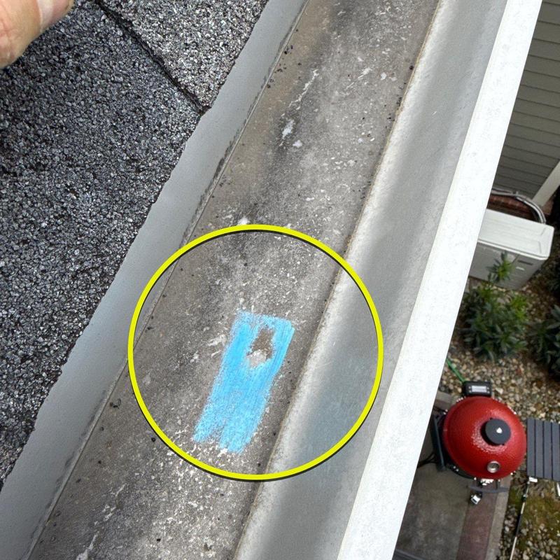 Roof gutter with marked damage inspection spot