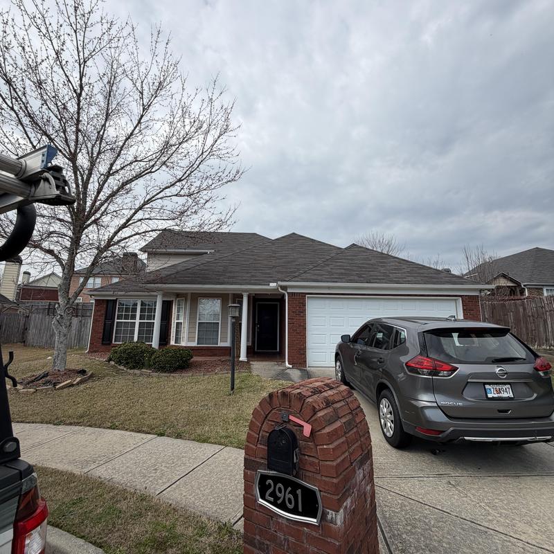 Roof shingles and pipe boot with tarp installed