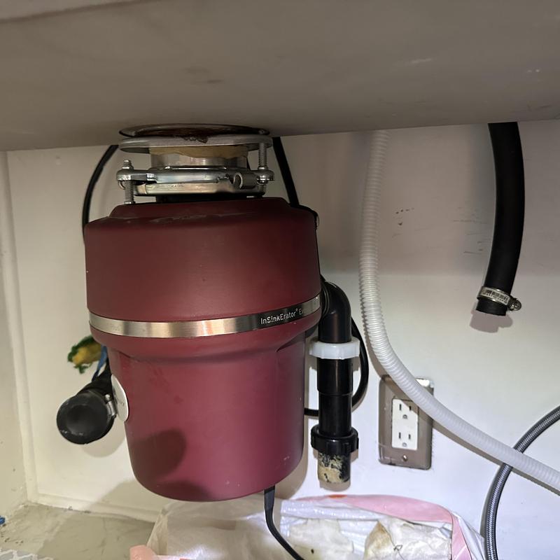 Garbage disposal unit under kitchen sink installation