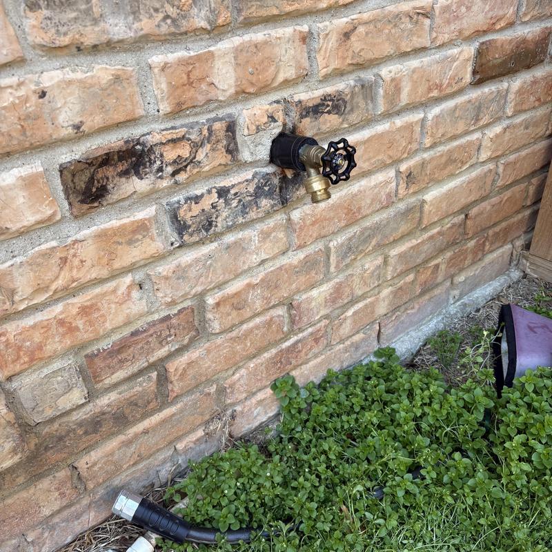 Outside hose bib replacement on brick wall