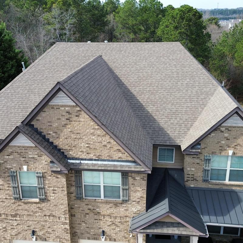 Roof shingles and front left gutter installation with splash control