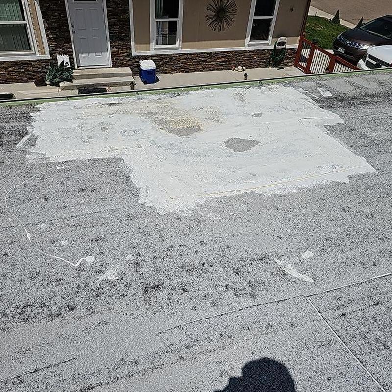 Flat roof patch with hail damage on modular home Flat roof patch with hail damage on modular home