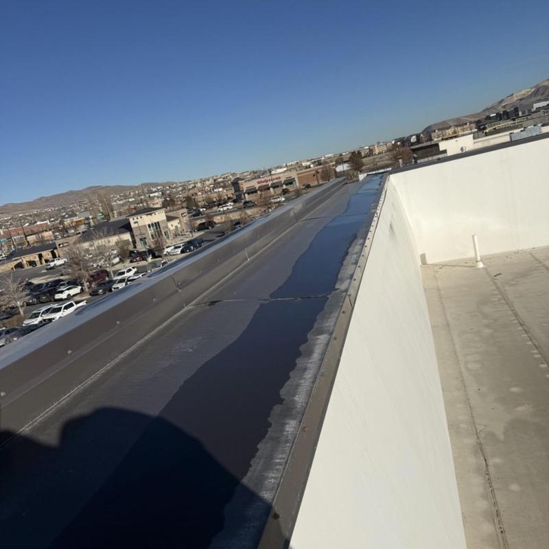 TPO commercial roof edge and drainage inspection