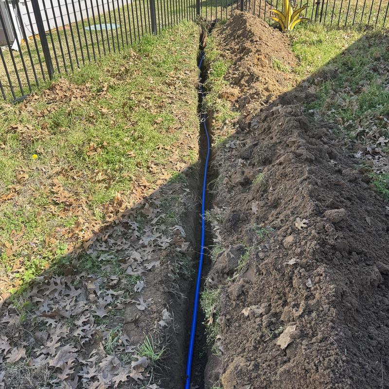 Water main trench excavation with pipe installation
