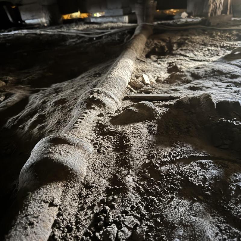 Cast iron sewer pipe under pier and beam home