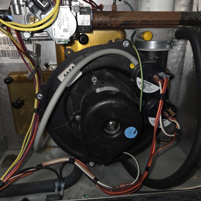 Gas furnace inducer motor with wiring and piping