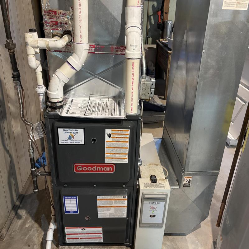 Goodman gas furnace with vent pipes in basement