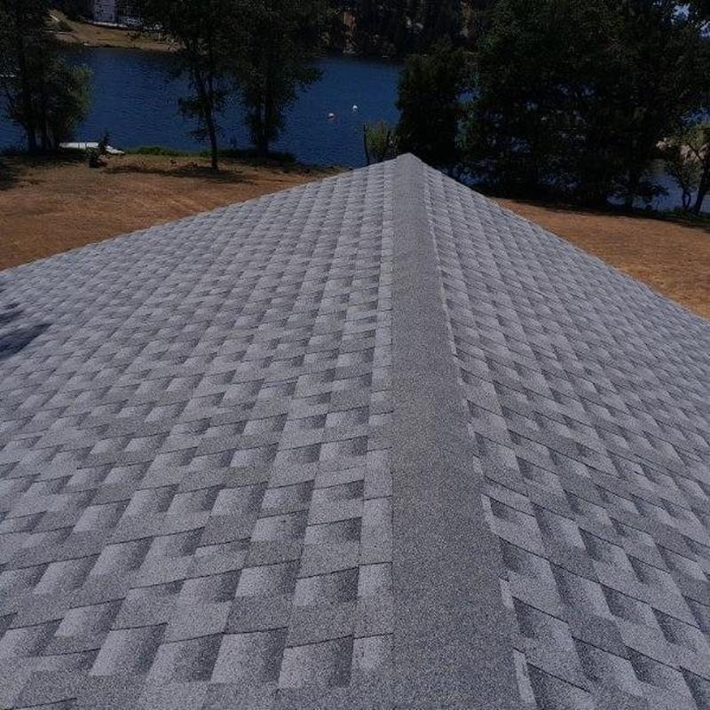 GAF lifetime asphalt roof with ridge cap near lake