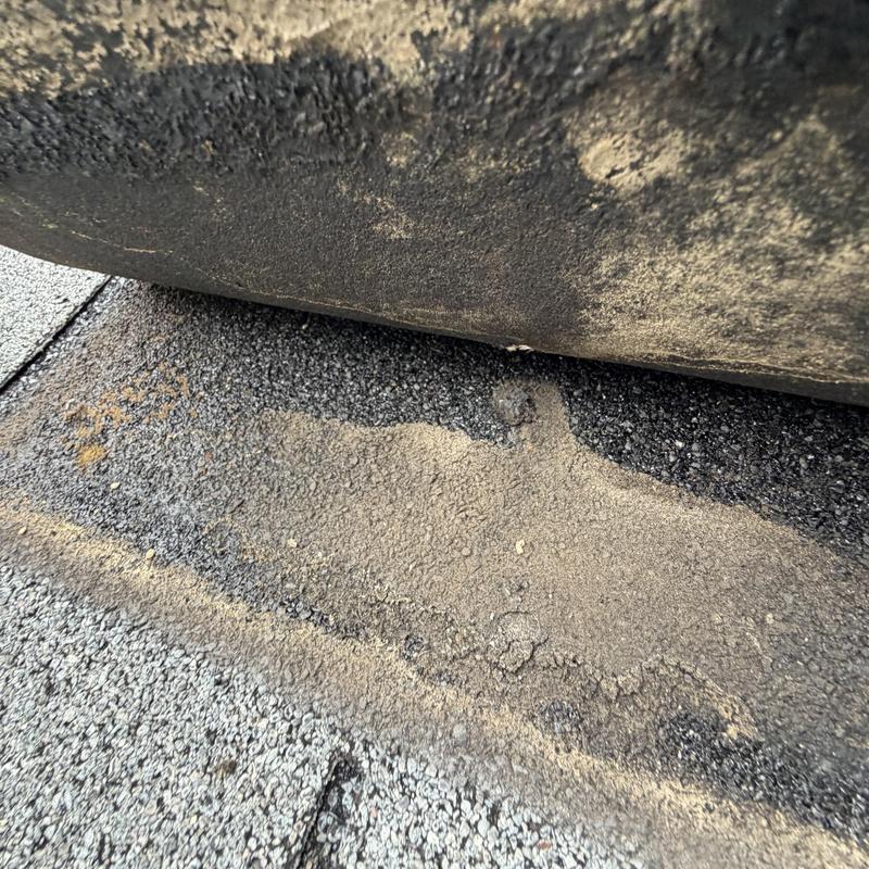 3-tab roof shingles with worn sealant and damage