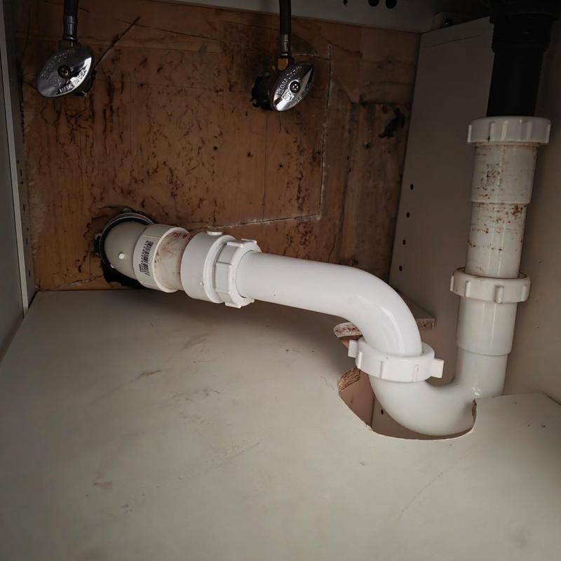 PVC P-trap and transition band under sink installation