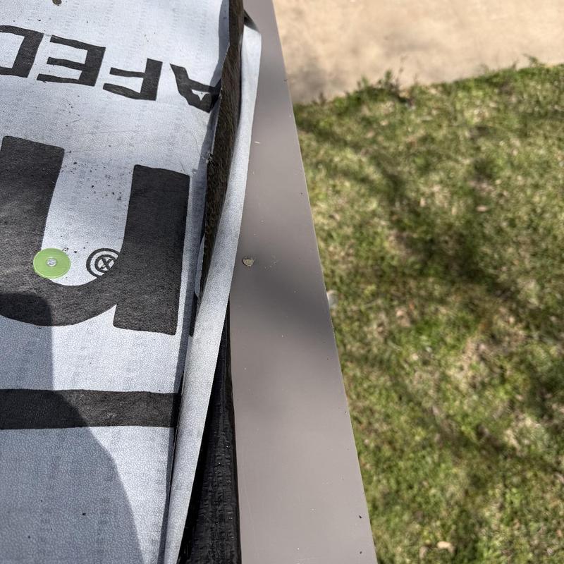 Metal drip edge installation on residential roof edge