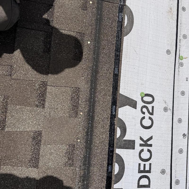 Asphalt shingle roof with synthetic underlayment installation