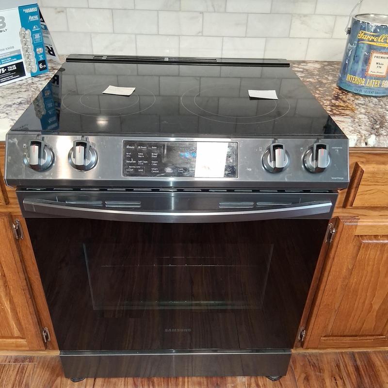 Electric cooktop stove installation in kitchen cabinetry