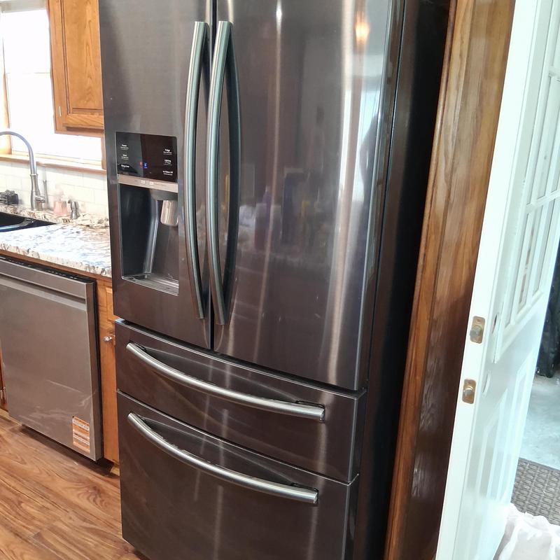 French door refrigerator installation with water dispenser