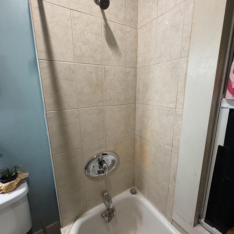 Moen Pozzi tub valve installed in tiled shower wall