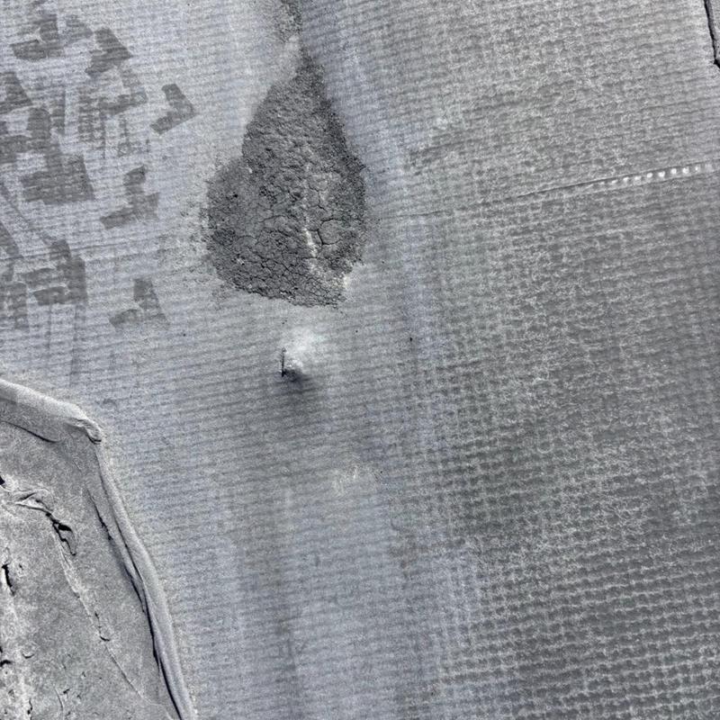 Commercial EPDM roof with puncture and damage area