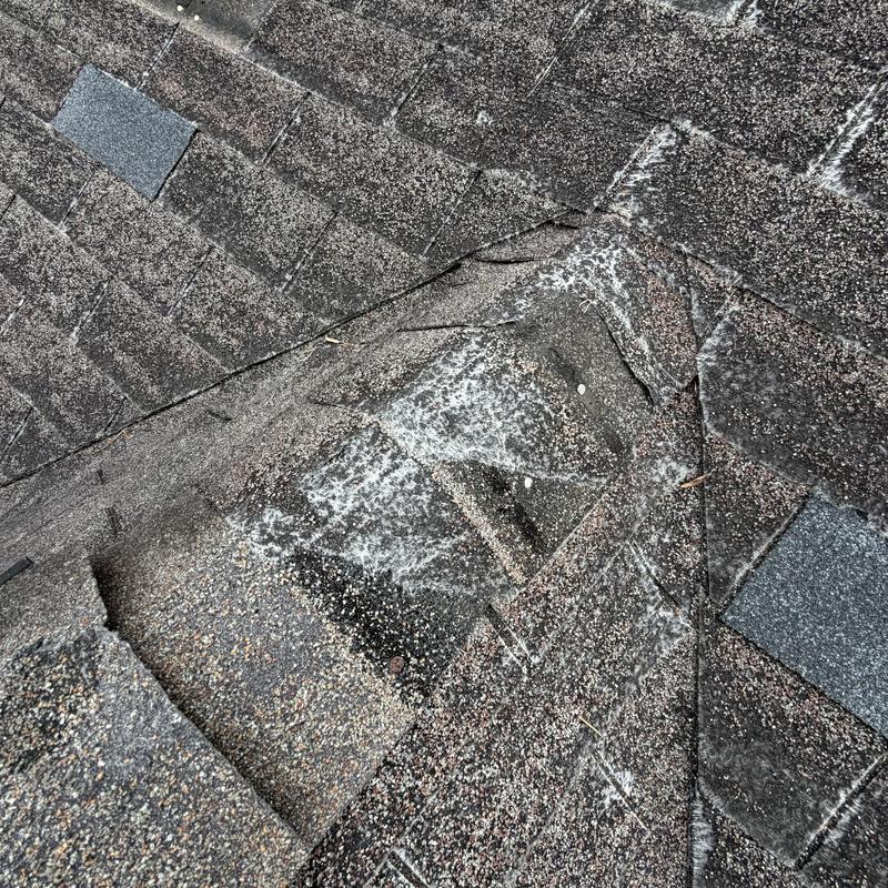 Roof shingles with missing and brittle sections