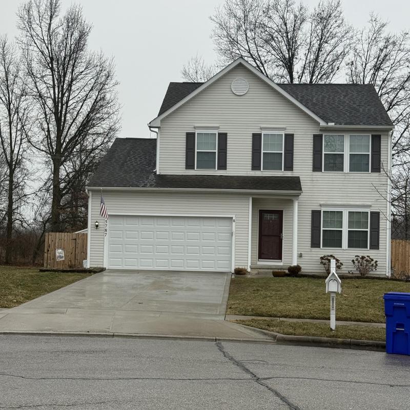 Roof shingles inspection on two-story suburban home Roof shingles inspection on two-story suburban home