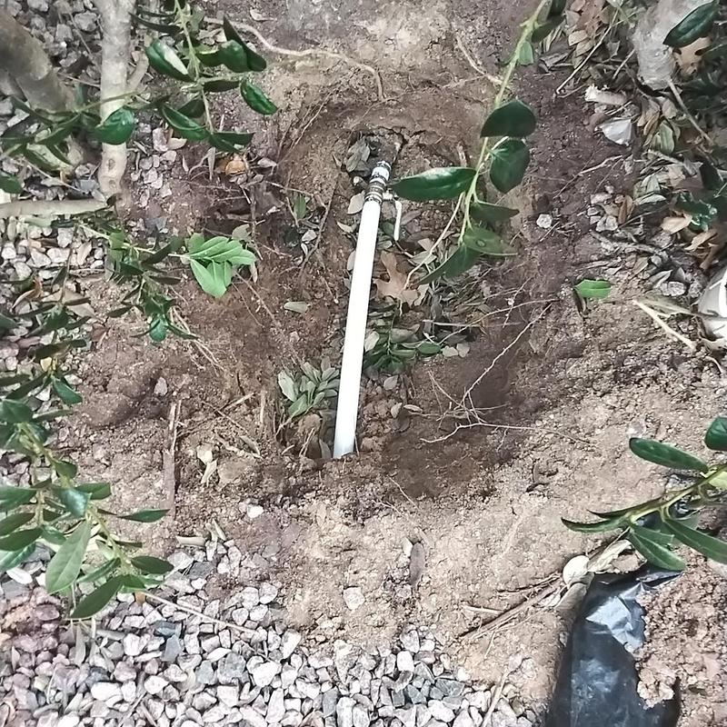 PVC water line with valve box installation in soil