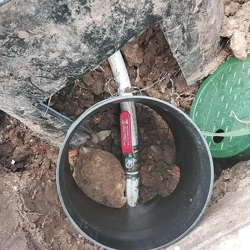 Ball valve and PVC water line in valve box excavation