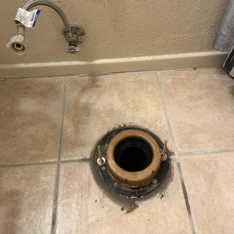 Toilet closet flange in floor tile, removed and ready