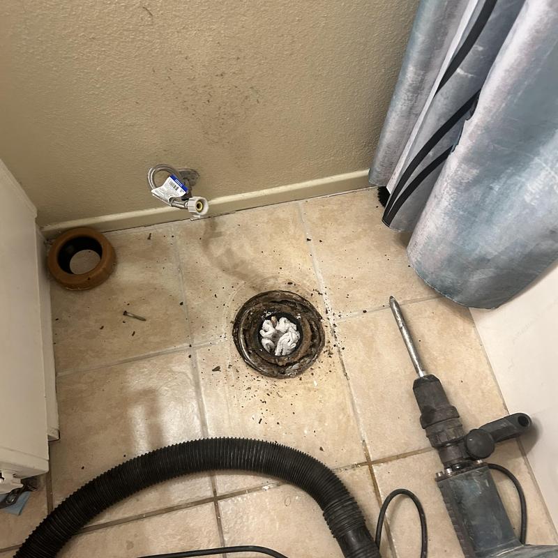 Toilet closet flange with debris and demolition tools