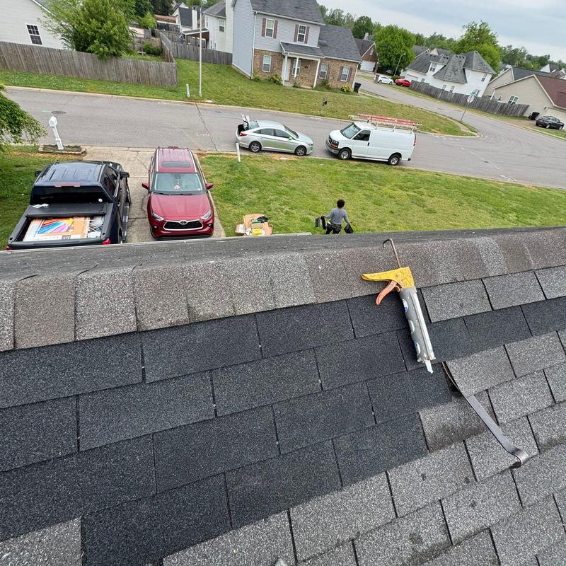 Asphalt shingle roof with ridge cap replacement tools