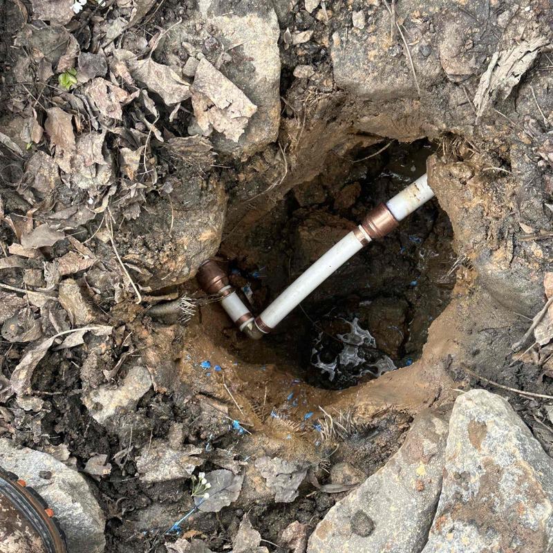 Copper and PVC underground pipe with leak repair site Copper and PVC underground pipe with leak repair site