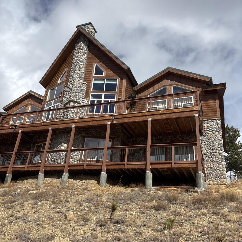 Green metal standing seam roof on wooden house Green metal standing seam roof on wooden house