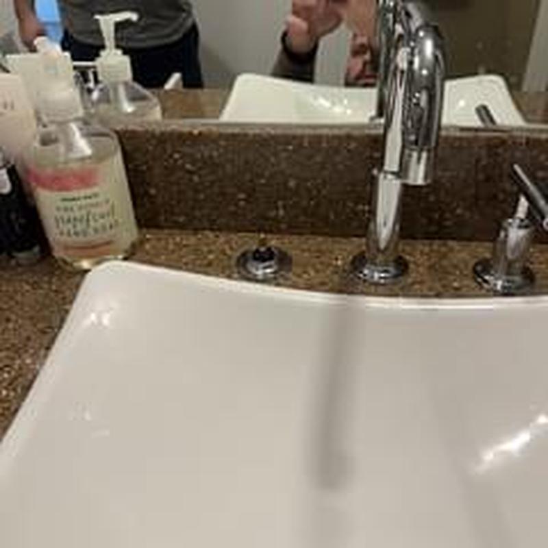 Bathroom sink faucet with two handles installed