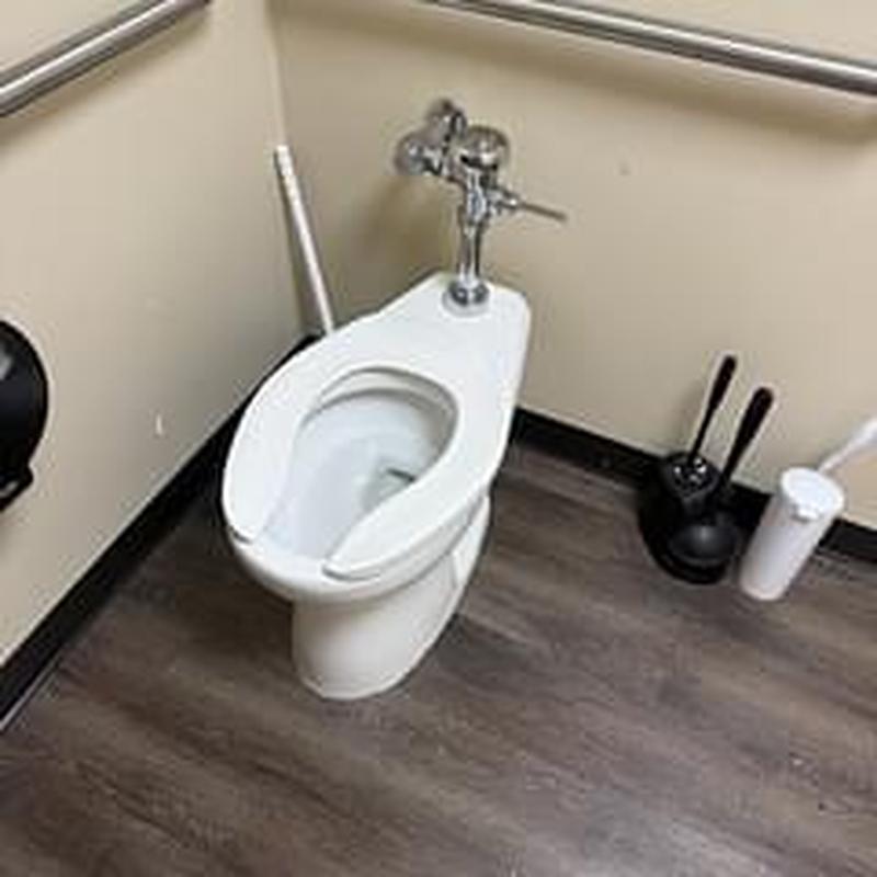 Toilet flushometer and spud pipe replacement in restroom