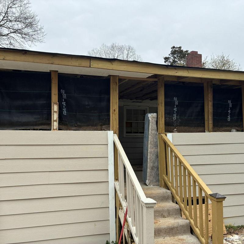 Porch siding and wood framing repair with insulation installation
