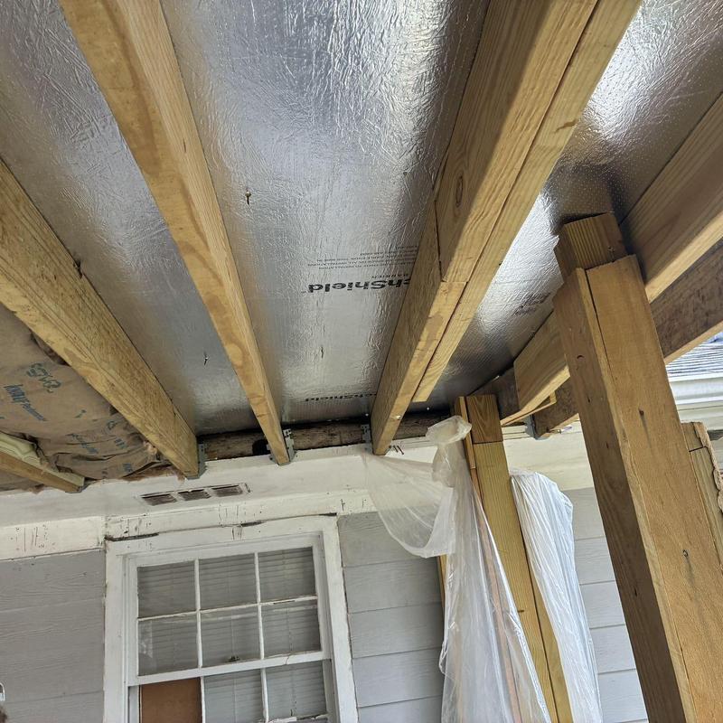 Reflective foil roof sheathing and wood framing installation