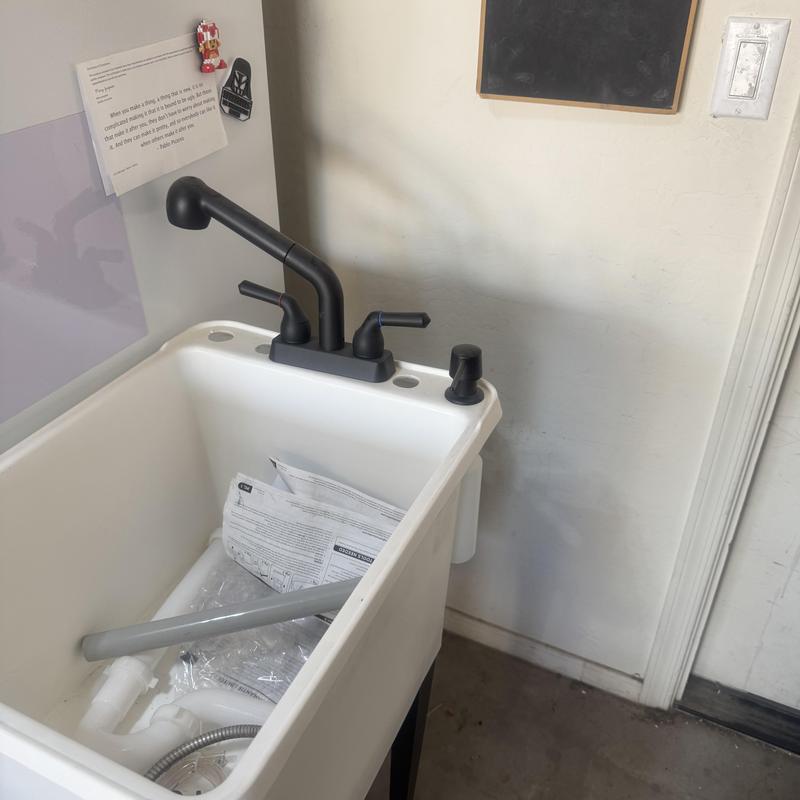 Laundry room utility sink with black faucet install