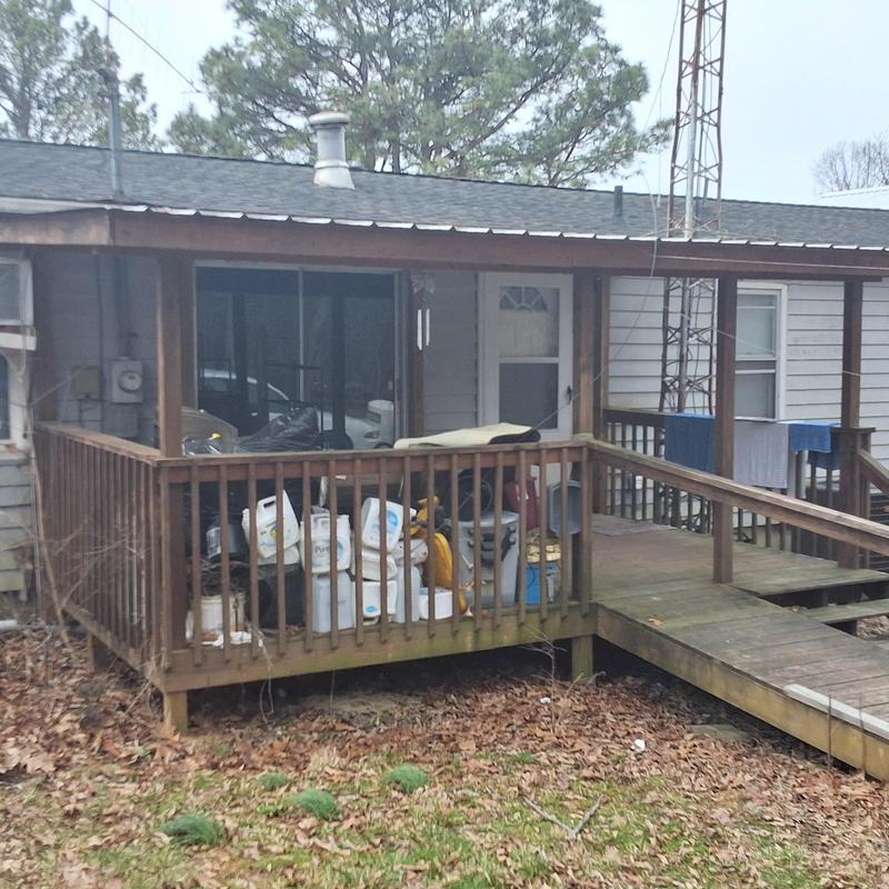Wooden porch and ramp attached to residential home