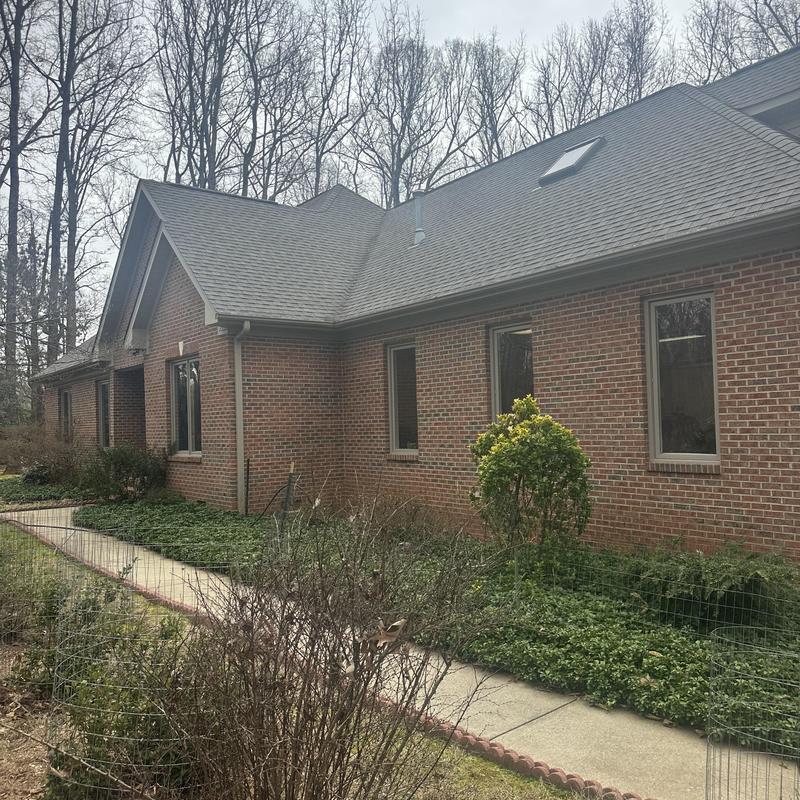 Roof skylight and gutter system on brick house