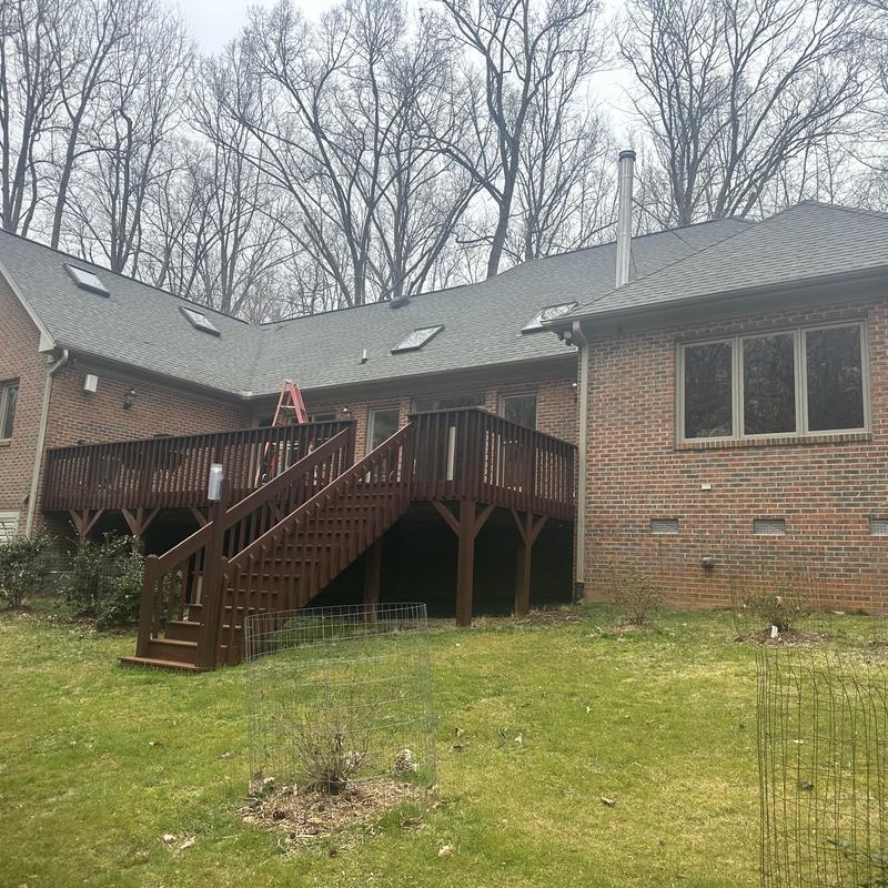 Skylights and gutters on residential roof with deck