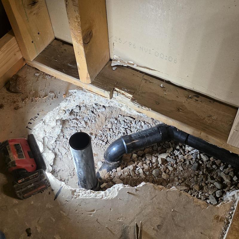 Shower drain pipe installation in floor cavity
