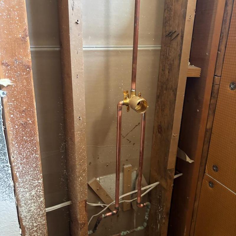 Shower valve installation with copper piping in wall cavity