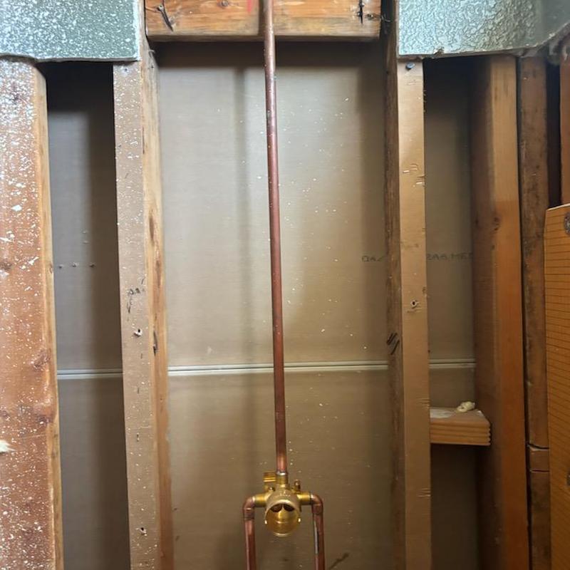 Shower valve installation with copper piping in wall cavity