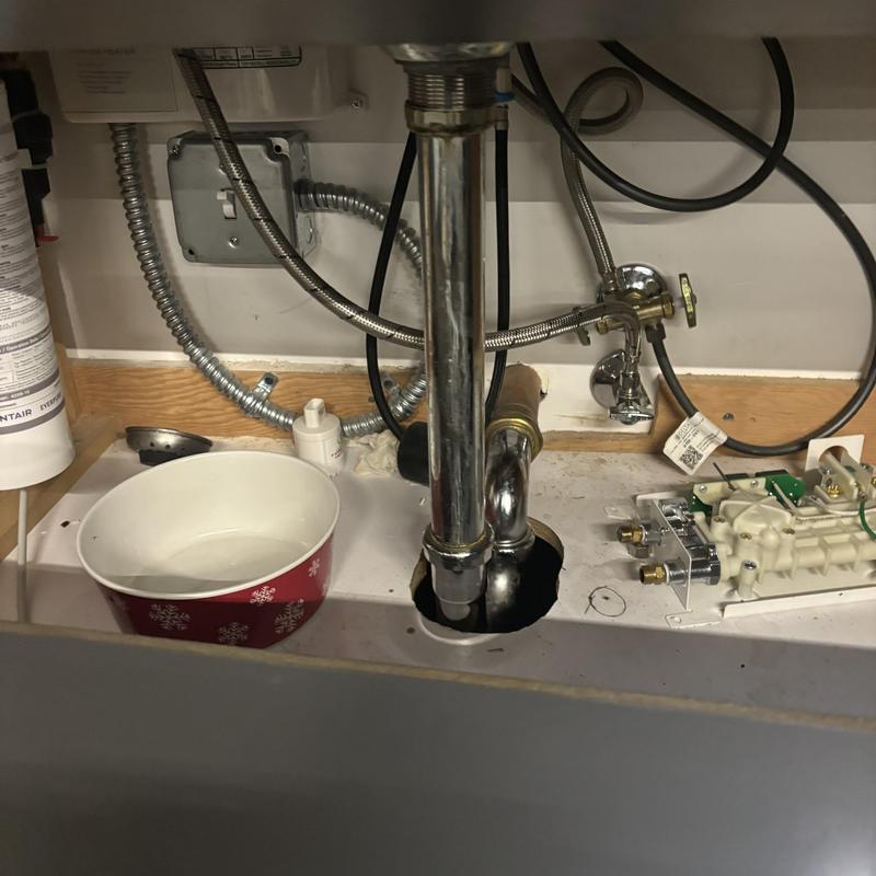 Sink drain pipe and water supply lines under sink