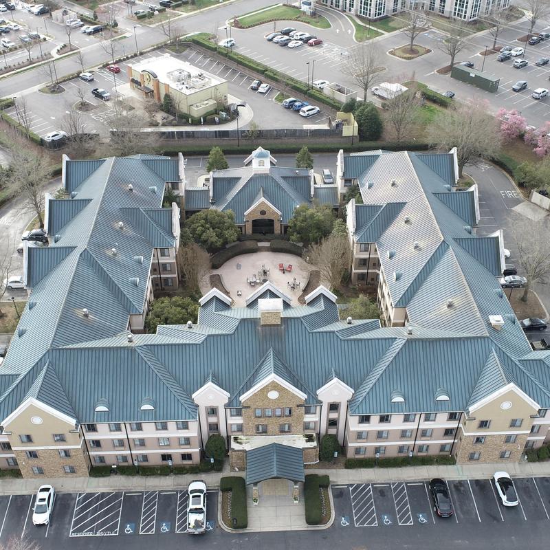Metal roof inspection at Staybridge Suites hotel