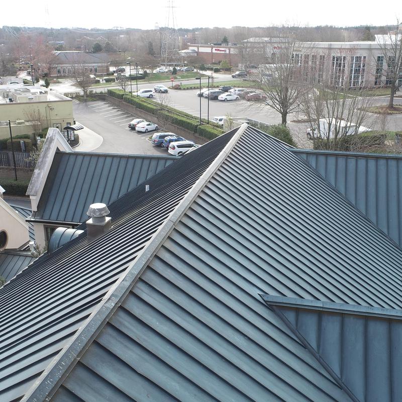 Copper standing seam roof at commercial building
