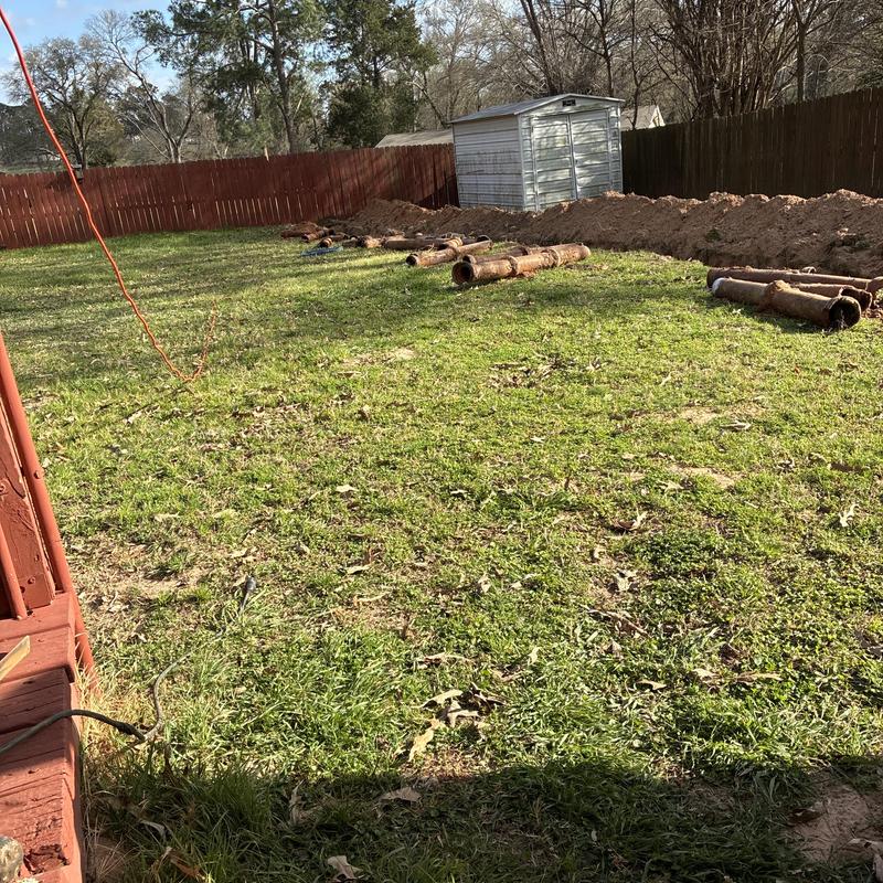 Sewer lateral pipes and backyard excavation site
