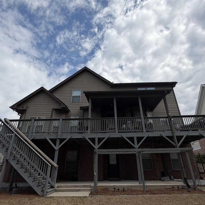 TREX deck installation on two-level wooden frame