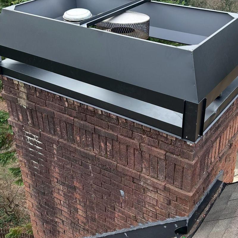 Chimney cap and flashing with replaced shingles